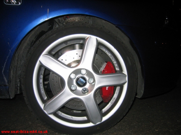 A closeup of the SeatSport 17" OZ Racing alloys, red Brembo brake calipers 